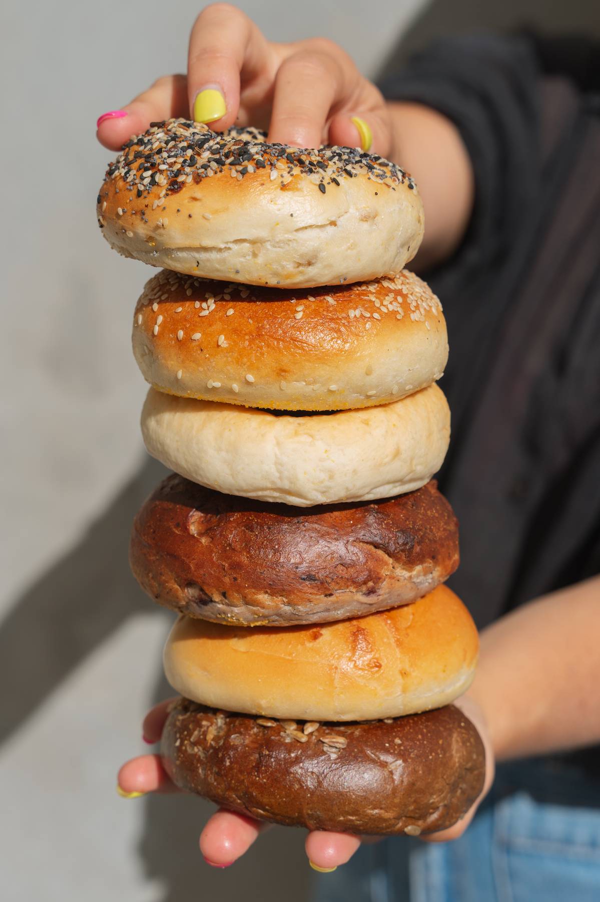 Stack of bagels held up