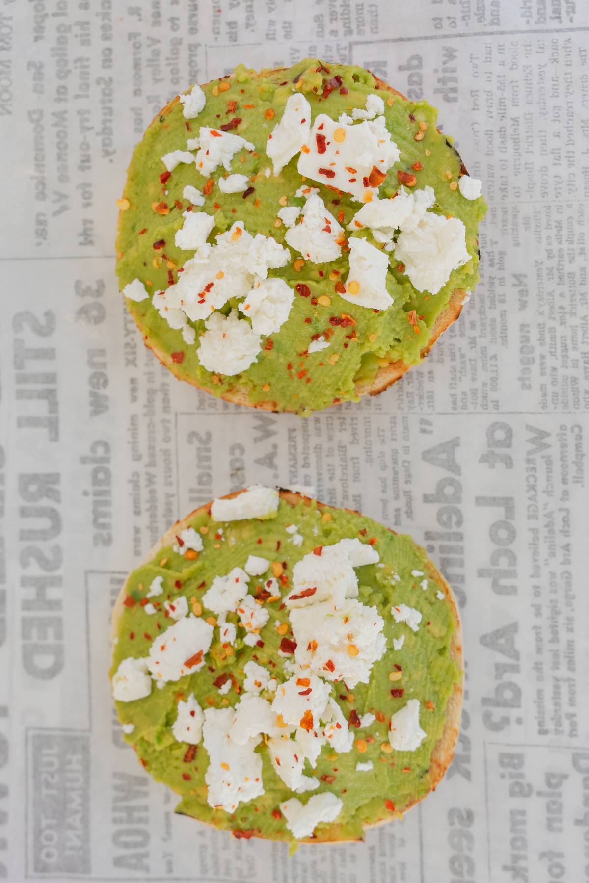 Smashed avo bagels with feta and chilli